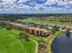 Aerial view of condo building with golf course, circled in red, indicating location at 8105 Grand Estuary Trl # 105, Bradenton, FL 34212