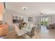 Bright open-concept living and dining room with access to a private lanai at 8105 Grand Estuary Trl # 105, Bradenton, FL 34212