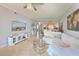 Inviting living area featuring neutral tones, tile flooring, and plenty of natural light at 8105 Grand Estuary Trl # 105, Bradenton, FL 34212