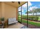 Inviting screened patio with golf course views, perfect for relaxing and enjoying the scenery at 8105 Grand Estuary Trl # 105, Bradenton, FL 34212