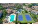 An aerial view shows the community pool, tennis courts and shuffleboard court at 8315 Glenrose Way # 1421, Sarasota, FL 34238