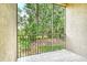 Tile floor screened balcony overlooking lush greenery, providing a serene and private outdoor space at 8315 Glenrose Way # 1421, Sarasota, FL 34238