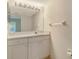 Bright bathroom with white vanity, large mirror, and recessed lighting at 8315 Glenrose Way # 1421, Sarasota, FL 34238