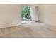 Inviting bedroom showcasing plush carpeting, and sliding doors that open to a private, screened balcony at 8315 Glenrose Way # 1421, Sarasota, FL 34238