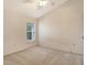 Bedroom featuring neutral carpet, and bright window at 8315 Glenrose Way # 1421, Sarasota, FL 34238