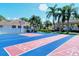 Shuffleboard court offers outdoor recreation in this community, surrounded by palm trees at 8315 Glenrose Way # 1421, Sarasota, FL 34238