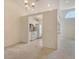 Bright kitchen features white appliances and cabinets and an open view to the dining area at 8315 Glenrose Way # 1421, Sarasota, FL 34238