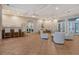 Spacious Pinetone community lounge with comfortable seating, bar area, and billiards room entrance at 8315 Glenrose Way # 1421, Sarasota, FL 34238
