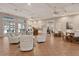 Bright community room featuring cozy seating, a bar area, and a billiard room for resident enjoyment at 8315 Glenrose Way # 1421, Sarasota, FL 34238