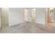 Spacious carpeted main bedroom featuring walk-in closet and adjoining bathroom at 8315 Glenrose Way # 1421, Sarasota, FL 34238