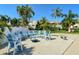 Comfortable adirondack chairs surrounding a fire pit offers relaxing outdoor living at 8315 Glenrose Way # 1421, Sarasota, FL 34238
