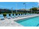 A refreshing community pool is surrounded by numerous lounge chairs for relaxing at 8315 Glenrose Way # 1421, Sarasota, FL 34238