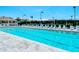 Beautiful pool with many lounge chairs, landscaping and lights at 8315 Glenrose Way # 1421, Sarasota, FL 34238