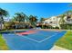 Brightly colored tennis court with trees around the perimeter of the multi Gathering community at 8315 Glenrose Way # 1421, Sarasota, FL 34238