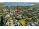 Aerial view of home in a lush neighborhood near a lake, highlighting the property's location at 8321 9Th Avenue Nw Ter, Bradenton, FL 34209