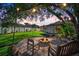 Cozy backyard fire pit area, perfect for gathering and enjoying outdoor evenings under the soft glow of string lights at 8321 9Th Avenue Nw Ter, Bradenton, FL 34209