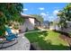 Landscaped backyard with lush grass, rock garden, mature trees, and screened in porch at 8321 9Th Avenue Nw Ter, Bradenton, FL 34209