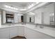 Well-lit bathroom featuring a large vanity with double sinks and mirrors at 8321 9Th Avenue Nw Ter, Bradenton, FL 34209