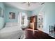 This bedroom features hardwood floors and a view into the bathroom at 8321 9Th Avenue Nw Ter, Bradenton, FL 34209