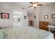 Bright bedroom with hardwood floors provides entry to ensuite bathroom with double sinks and vanity at 8321 9Th Avenue Nw Ter, Bradenton, FL 34209