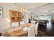 Beautiful dining room with hardwood floors, modern lighting, and a large wooden hutch for ample storage at 8321 9Th Avenue Nw Ter, Bradenton, FL 34209