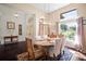 Formal dining room with a wooden table and chairs, offering a sophisticated dining experience at 8321 9Th Avenue Nw Ter, Bradenton, FL 34209