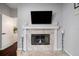Elegant marble fireplace with decorative mantle, flanked by wrought iron candle stands at 8321 9Th Avenue Nw Ter, Bradenton, FL 34209