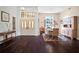 Elegant foyer with double doors, high ceilings, dark wood floors, and natural light flowing into the entry at 8321 9Th Avenue Nw Ter, Bradenton, FL 34209