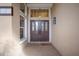 Inviting front entrance with double doors, decorative glass panels, and a tiled porch with a 'welcome' mat at 8321 9Th Avenue Nw Ter, Bradenton, FL 34209
