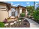 Attractive front yard with landscaped garden beds, stone pathway, and a well-maintained exterior with decorative shutters at 8321 9Th Avenue Nw Ter, Bradenton, FL 34209