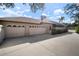 Attached three-car garage offers ample parking and storage space with arched windows at 8321 9Th Avenue Nw Ter, Bradenton, FL 34209