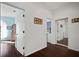 Hallway leading to bedrooms with dark hardwood floors at 8321 9Th Avenue Nw Ter, Bradenton, FL 34209