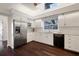 Bright kitchen featuring white cabinets, stainless steel appliances, granite countertops, and dark wood flooring at 8321 9Th Avenue Nw Ter, Bradenton, FL 34209