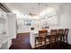 Modern white kitchen with granite countertops, a central island, and updated stainless steel appliances at 8321 9Th Avenue Nw Ter, Bradenton, FL 34209