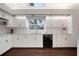 Charming kitchen featuring white cabinets, granite countertops, stainless steel appliances and tile backsplash at 8321 9Th Avenue Nw Ter, Bradenton, FL 34209