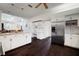 Open concept kitchen with stainless steel appliances, granite counters, built in desk, and hardwood floors at 8321 9Th Avenue Nw Ter, Bradenton, FL 34209