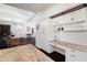 Kitchen area featuring granite countertops, built in desk, and wine rack and hardwood floors at 8321 9Th Avenue Nw Ter, Bradenton, FL 34209