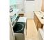 Bright laundry room features updated washer/dryer, shelving, and sink with vanity at 8321 9Th Avenue Nw Ter, Bradenton, FL 34209