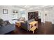 Bright living room with vaulted ceilings, custom built-ins, hardwood floors, and views of the backyard pool at 8321 9Th Avenue Nw Ter, Bradenton, FL 34209