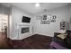 Cozy living room with fireplace, hardwood floors, and view to the kitchen at 8321 9Th Avenue Nw Ter, Bradenton, FL 34209