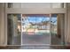 View from inside of a screened pool area with a patio and a clear blue sky at 8321 9Th Avenue Nw Ter, Bradenton, FL 34209