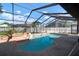 Stunning backyard pool and spa featuring a screen enclosure and a meticulously landscaped yard at 8321 9Th Avenue Nw Ter, Bradenton, FL 34209