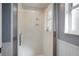This bathroom features a bright shower with glass doors and a window at 8321 9Th Avenue Nw Ter, Bradenton, FL 34209