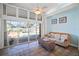 Relaxing sunroom with tile floors and expansive views of the private backyard and sparkling pool at 8321 9Th Avenue Nw Ter, Bradenton, FL 34209