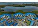 Aerial view of waterfront condo community with lush surroundings and ample parking at 939 Sandpiper Cir, Bradenton, FL 34209