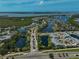 An aerial view of the community showcasing waterfront living, manicured landscapes, and various recreational amenities at 939 Sandpiper Cir, Bradenton, FL 34209