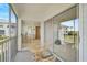 Private balcony features seating and access to the interior living space and bedroom at 939 Sandpiper Cir, Bradenton, FL 34209
