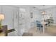 Inviting dining area with white tile floors and charming blue chairs at 939 Sandpiper Cir, Bradenton, FL 34209