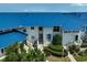 Attractive condo with a vibrant blue roof and well-maintained landscaping at 939 Sandpiper Cir, Bradenton, FL 34209