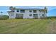 Attractive two-story condo with manicured lawn and bushes at 939 Sandpiper Cir, Bradenton, FL 34209